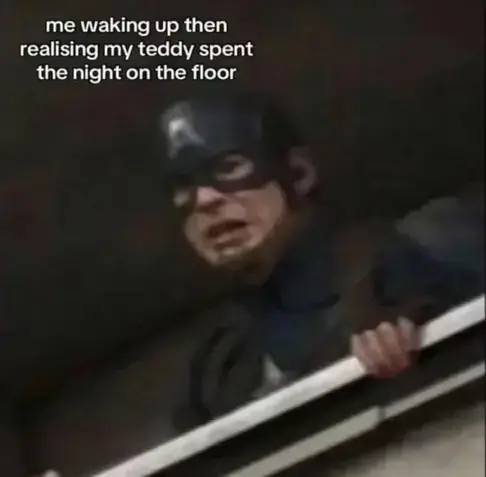 Captain America looking distraught over a balcony with the caption: "me waking up then realising my teddy spent the night on the floor".